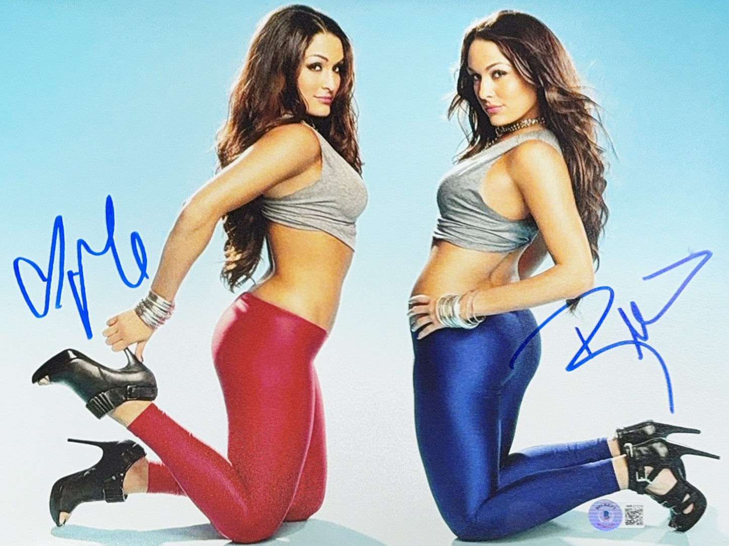 Nikki & Brie The Bella Twins Autographed WWE Pink And Blue Leggings 11x14 Beckett