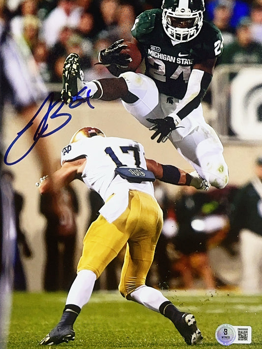Leveon Bell Autographed Michigan State Green Jersey Hurdle Vertical 8x10 Beckett