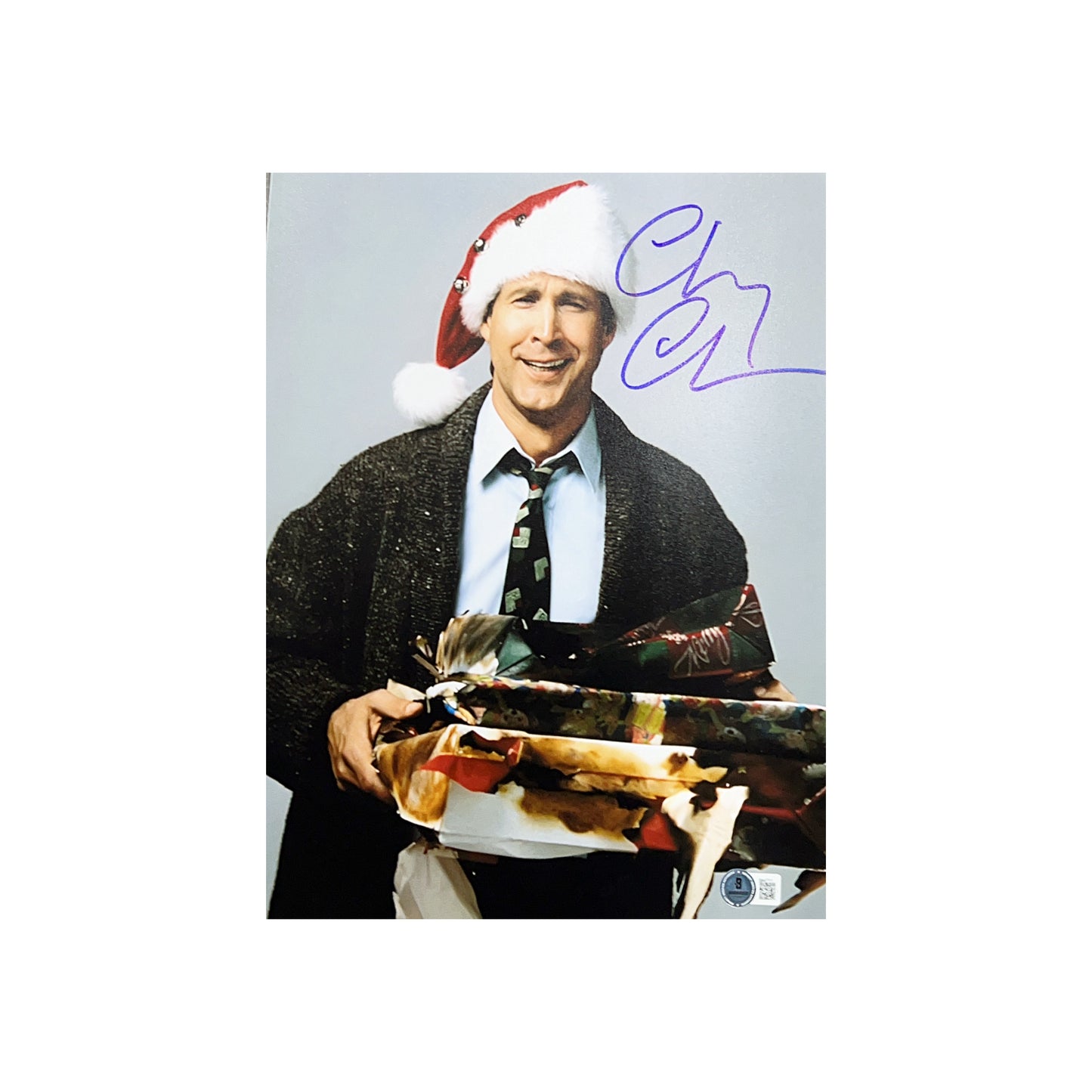 Chevy Chase Autographed National Lampoon’s Christmas Vacation Holding Presents 11x14 Beckett
