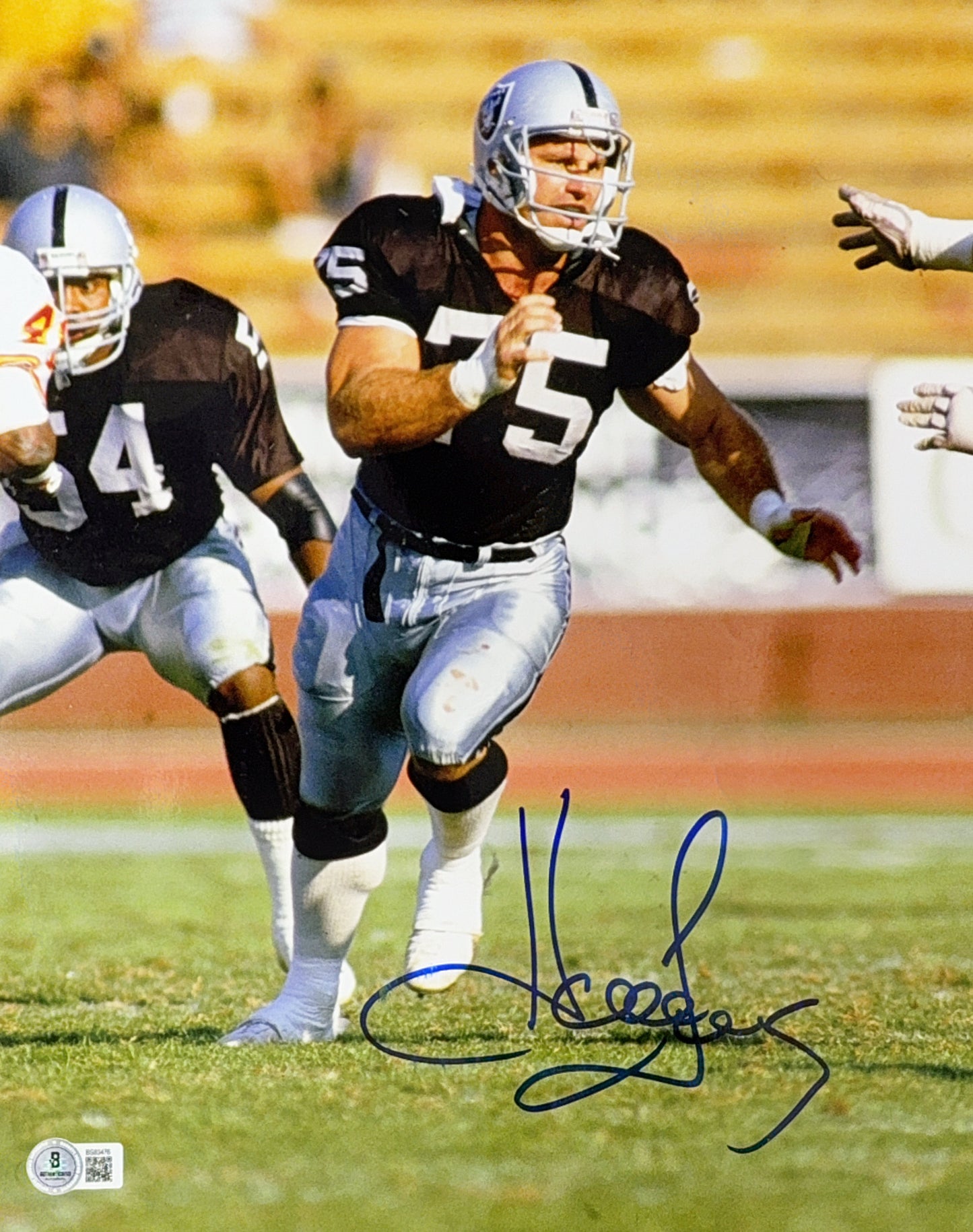 Howie Long Autographed Oakland Raiders Running Black Jersey 11x14 Beckett