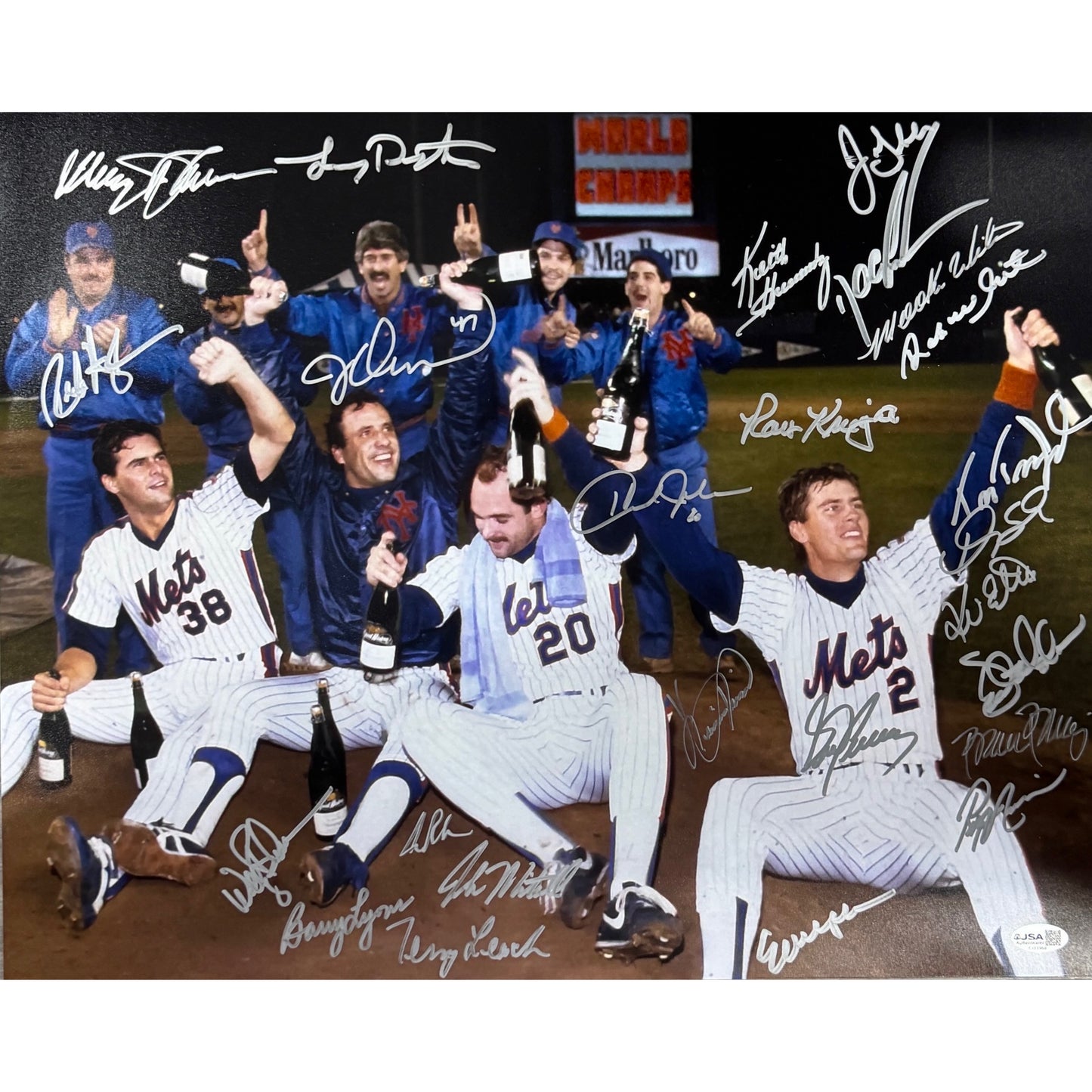 1986 New York Mets Team Autographed Team Sitting Champagne Celebration DSX 16x20 Horizontal JSA
