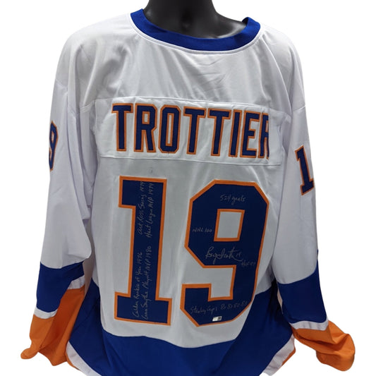 Bryan Trottier Autographed New York Islanders White Jersey 524 Goals, NHL 100, HOF 97, Stanley Cups 80, 81, 82, 83, Calder Rookie of Year 1976, Conn Smythe Playoffs MVP 1980, Art Ross Scoring 1979, Hart League MVP 1979 Inscriptions Steiner CX