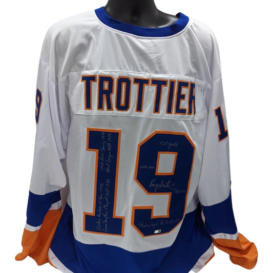 Bryan Trottier Autographed New York Islanders White Jersey “524 Goals, NHL 100, HOF 97, Stanley Cups 80, 81, 82, 83, Calder Rookie of Year 1976, Conn Smythe Playoffs MVP 1980, Art Ross Scoring 1979, Hart League MVP 1979” Inscriptions Steiner CX